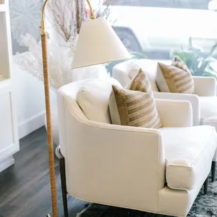 Unique lighting, custom upholstery, handmade throw pillows and beautiful artwork pictured