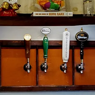 a row of beer taps