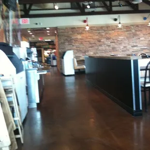 a view of a restaurant with tables and chairs