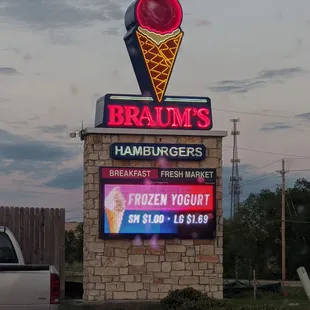 a sign for a frozen yogurt