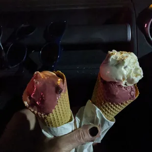 two ice cream cones in a car