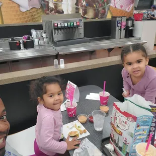 a group of people sitting at a table