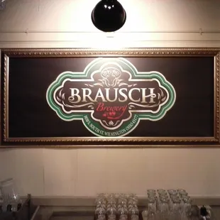 a bar with a sign above it