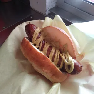 Smoked bratwurst with spicy brown mustard.