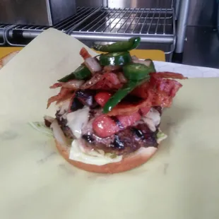 El cuycuy burger! It has a hot dog, bacon, chili, fresh grilled jalapeno, grilled onion, cheese , all on a juicy, thick patty!