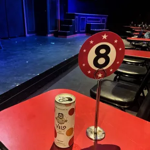 View from a front row table with a beverage on top