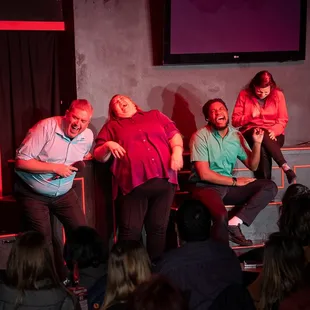 The cast enjoys a chuckle during Hindsight is 2020: The Best of the Brave New Workshop