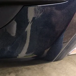 Rear left side of bumper where paint is runny.