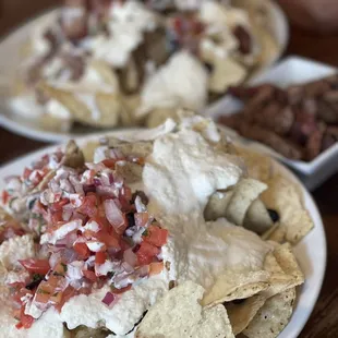 Bravo nachos with tri tip on the side on one