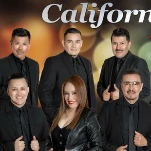 a group of men and women posing for a picture