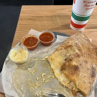 At Bravo NY Pizzeria in Palm Harbor, I enjoyed a delicious meat lovers calzone served on a round pizza tray.