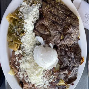 Bravo chillesquillas  has a thin steak on it