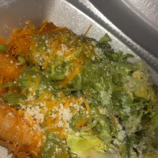 Rolled chicken tacos with guacamole