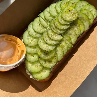 Bagel toast with herbed cream cheese, Persian cucumbers