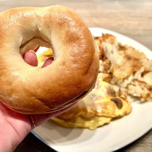 Mushroom &amp; Swiss Omelette with hash browns and a plain bagel.