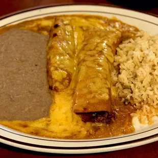 Bravo hot portion of the meal. Tamale and ground beef enchilada with beans and savory rice.