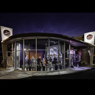 a group of people standing outside of a building