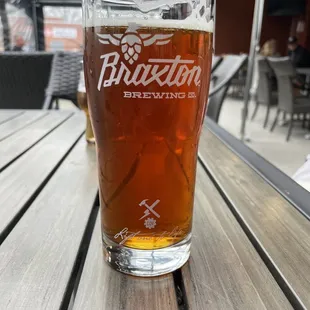 a glass of beer on a table