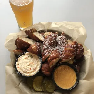 Scooter blood orange radler with pretzels and beer cheese and pimento cheese