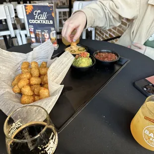 Tot trio guac, queso and salsa dipping sauce. All were great!