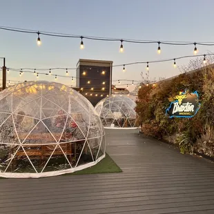 a patio area with a glass dome