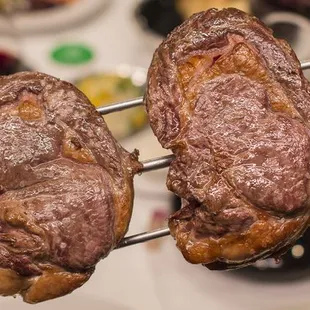 two steaks on a skewer
