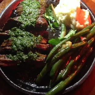 Steak with chimichurri sauce.
