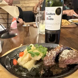 Picanha na Chapa-grilled Picanha steak served with steamed yuca, rice, Brazilian pico de gallo, and toasted cassava flour