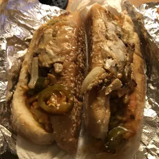 two hot dogs on tin foil