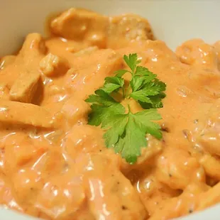 a bowl of chicken and pasta