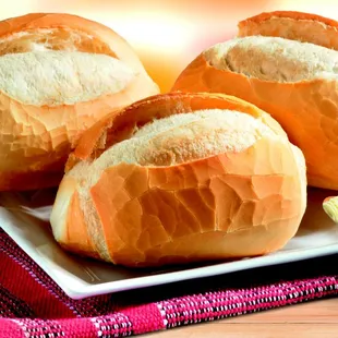 three bread rolls on a plate