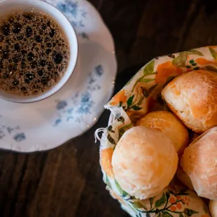 a cup of coffee and rolls