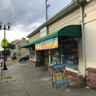 a sidewalk with a sign in front of it