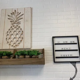a pineapple sign and a planter
