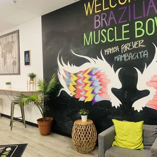 a black wall with colorful wings