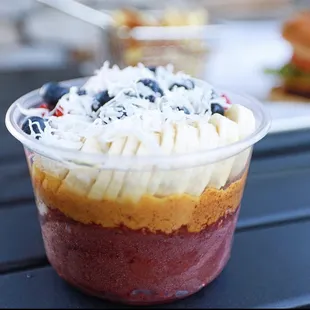 a dessert in a plastic cup