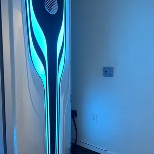 Stand up tanning booth.