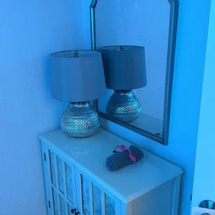 What is in each room, a mirror, little towel, eye wear if necessary and hooks to hang things on.