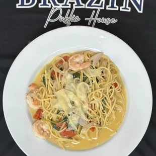 a plate of pasta with shrimp