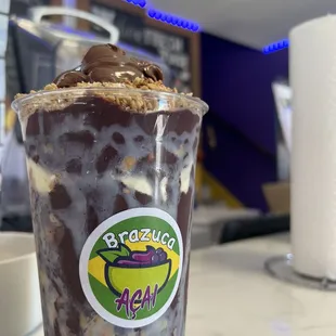 a chocolate milkshake in a plastic cup