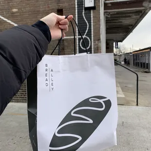 Cute bread bag!! Look for the art on the wall to find the entrance