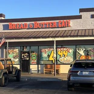 two jeeps parked in front of the store