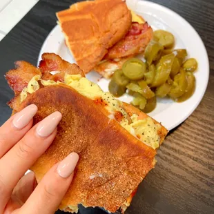 Bacon egg and cheese on a flattened short roll