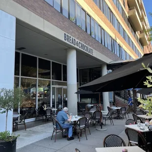 outside of building with tables and chairs