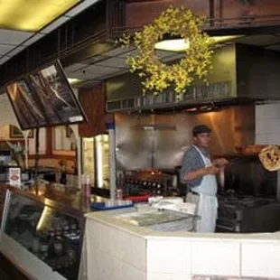 a man preparing food in a restaurant