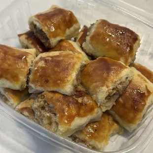 a variety of pastries in a plastic container