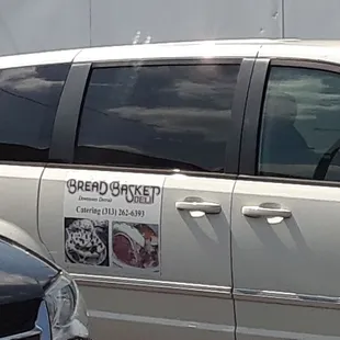 a white van parked in a parking lot