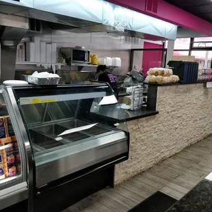 a bakery counter with a display case