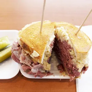a corned beef sandwich with pickles