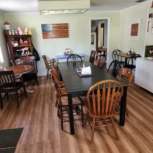 a dining room with tables and chairs